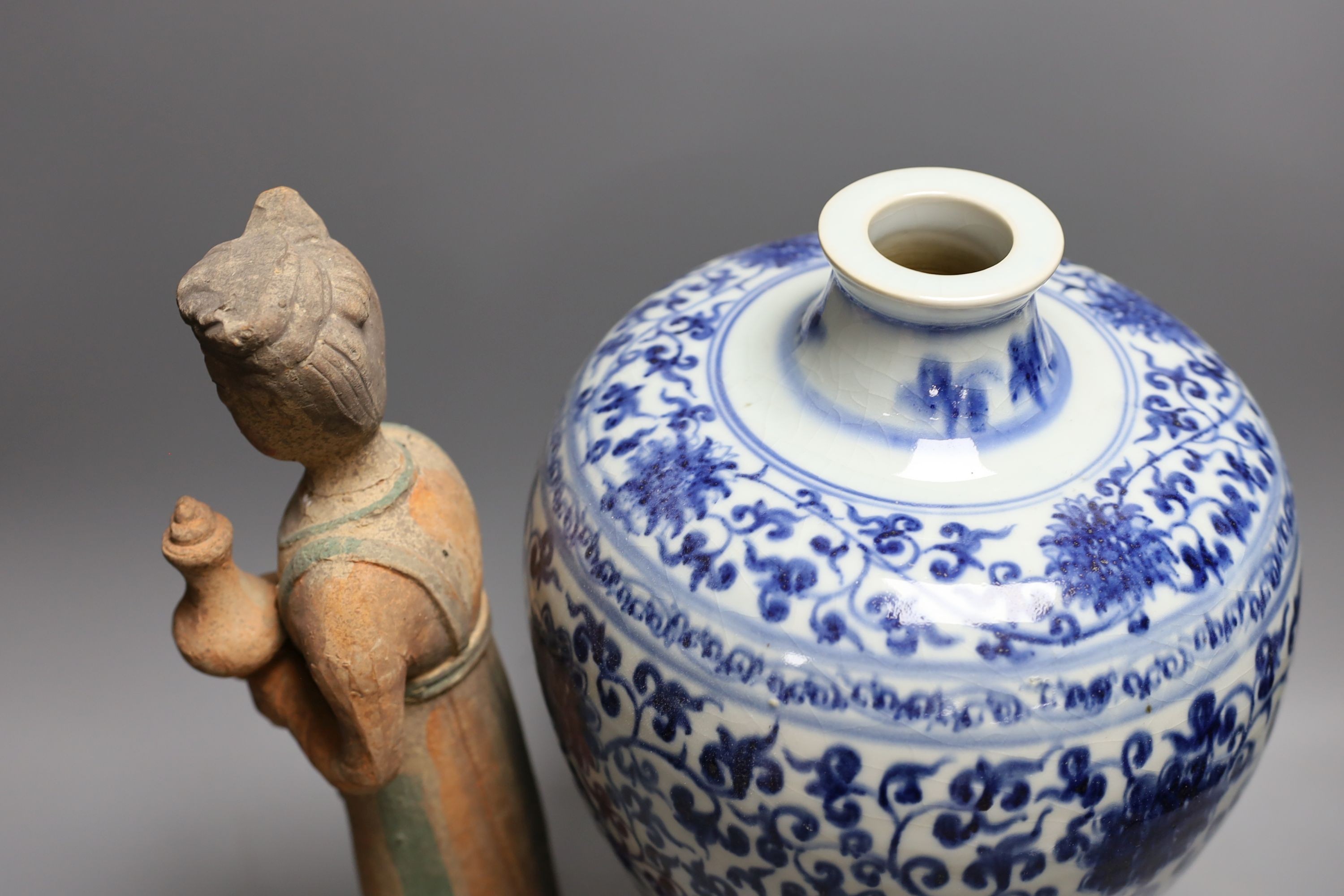 A large Chinese blue and white meiping and a Tang style pottery figure (2), vase 37 cms high.